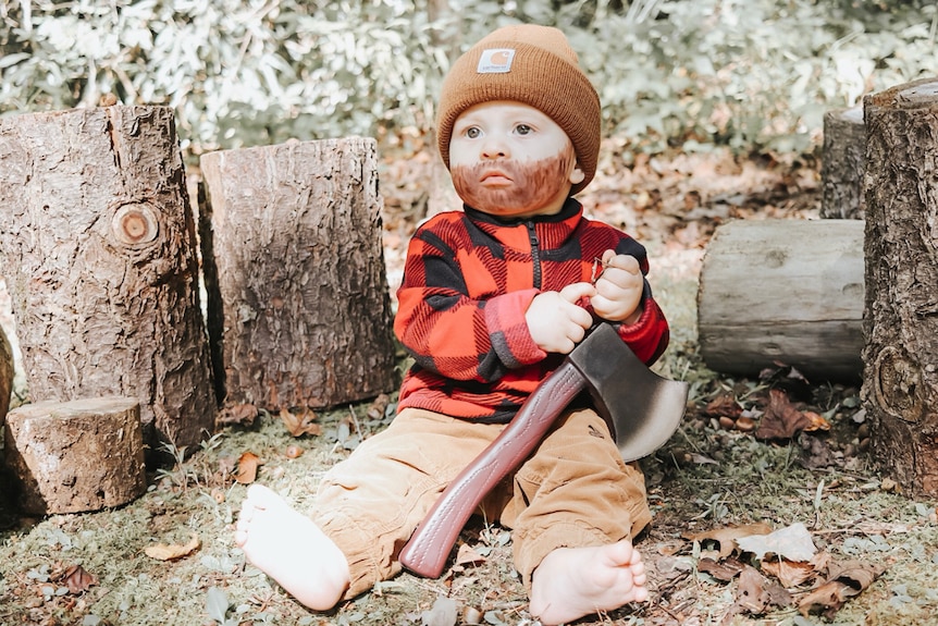 Baby in lumberjack costume