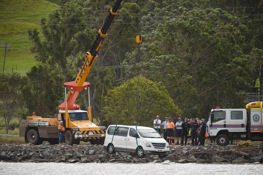 A car is removed from the Tweed River near Tumbulgum where a mother and her two children died.