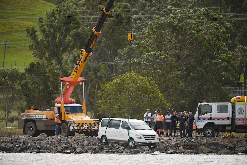 A car is removed from the Tweed River near Tumbulgum where a mother and her two children died.