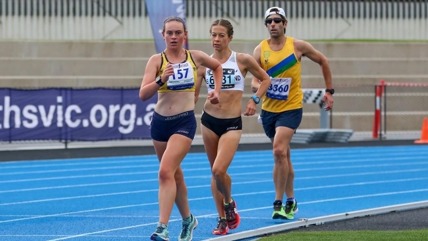 Bec Henderson and two other race walkers round the track during a rack.