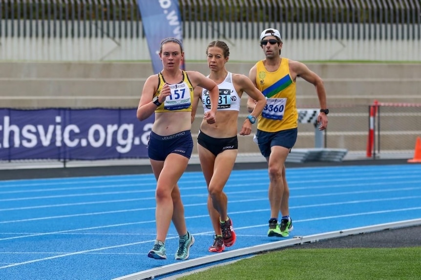 Bec Henderson and two other race walkers round the track during a rack.
