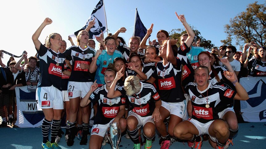 Victory pose with the W-League trophy