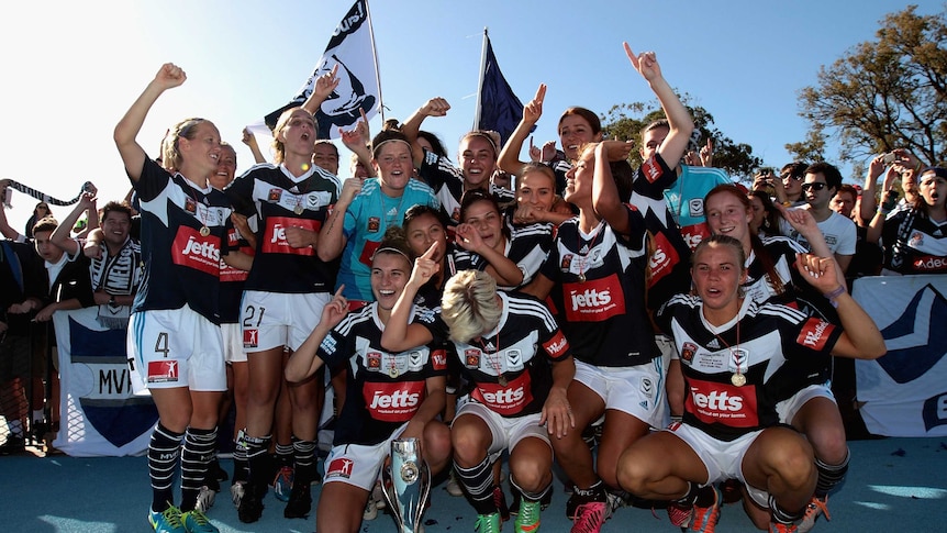Winners are grinners ... The Victory celebrate with the W-League trophy