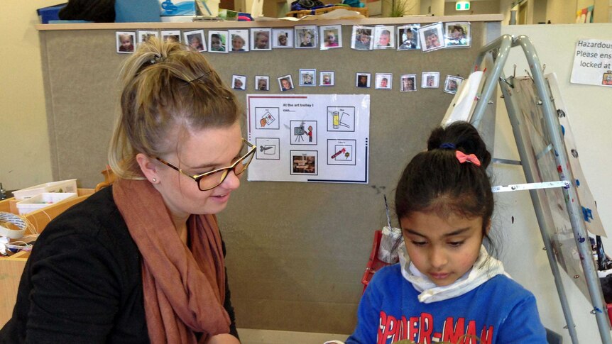 Autism centre teacher Ellie Kaine with student