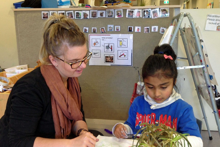 Autism centre teacher Ellie Kaine with student