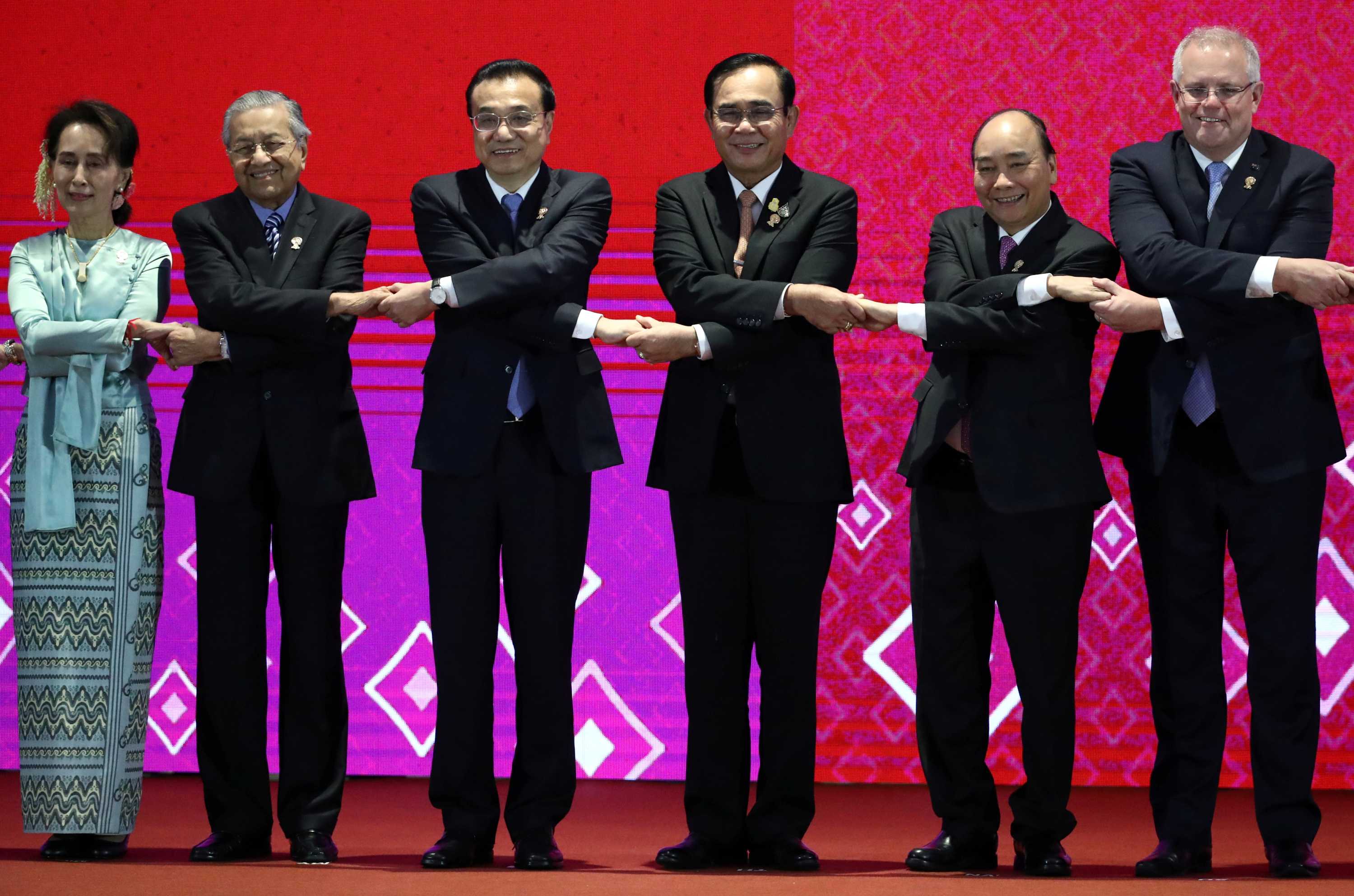Scott Morrison shakes hands at the East Asia Summit (EAS) in Bangkok, Thailand, November 4, 2019.