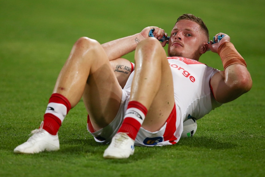 george burgess lies on his back and looks towards the camera