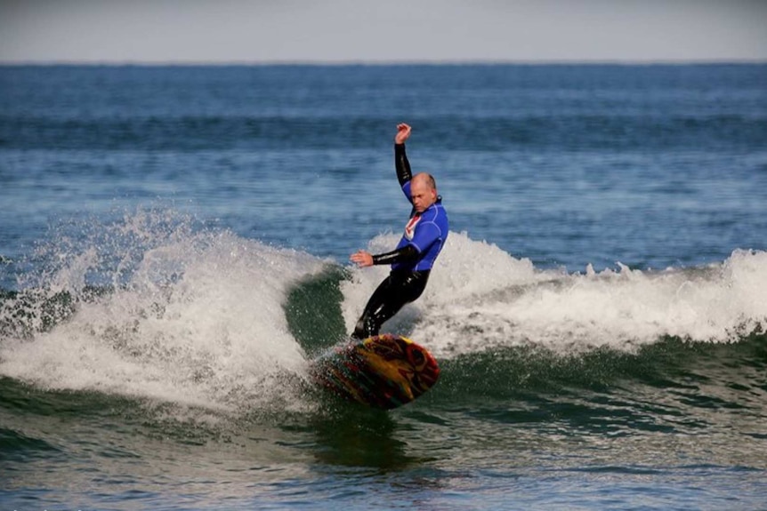 Yestin Griffiths surfing at the Victorian Surf Coast on a long board