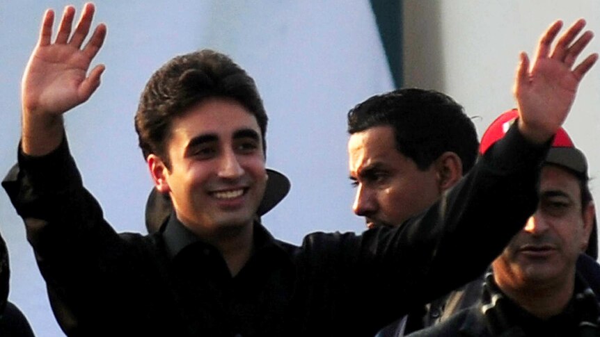 Bilawal Bhutto, son of assassinated former Pakistani premier Benazir Bhutto, waves to supporters outside his family's mausoleum.