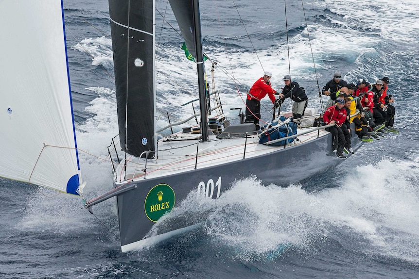 The crew of 52-foot yacht, Ichy Ban, sail in to take handicap honours in the Sydney to Hobart.
