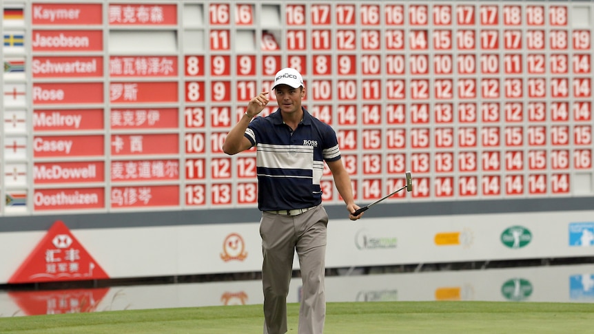Storming home ... Martin Kaymer sunk one of his seven birdies on the 18th. (Getty: Andrew Redington)