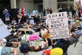 Protesters laid down on the ground outside the law courts in unison in a 'die-in', representing what they say is still too many Aboriginal deaths in custody 25 years on from a Royal Commission