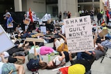 Protesters laid down on the ground outside the law courts in unison in a 'die-in', representing what they say is still too many Aboriginal deaths in custody 25 years on from a Royal Commission