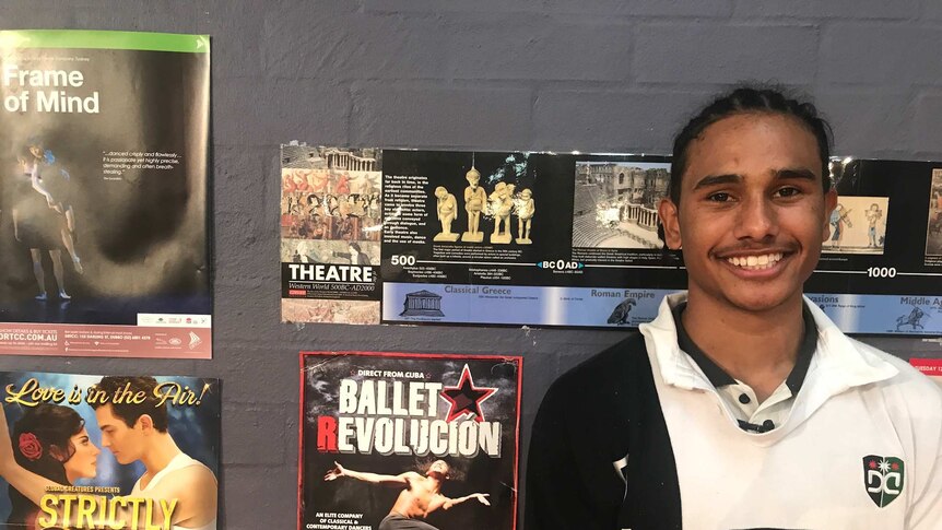 17-year-old aspiring dancer Ngali Shaw stands next to theatre posters