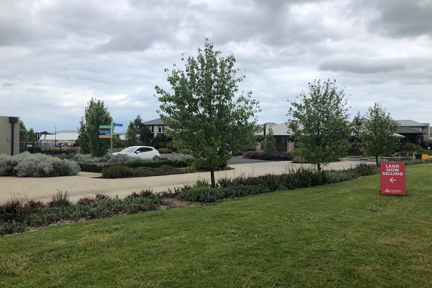 A sign saying Land Now Selling in a housing estate in Geelong.