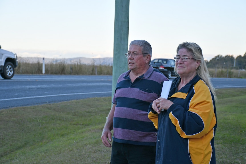 Tony and Janelle O'Brien survey the road out the front of their Chambers Flat property