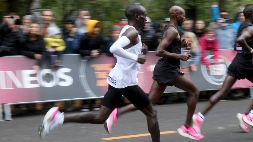 A side-on image of marathon runner Eliud Kipchoge.