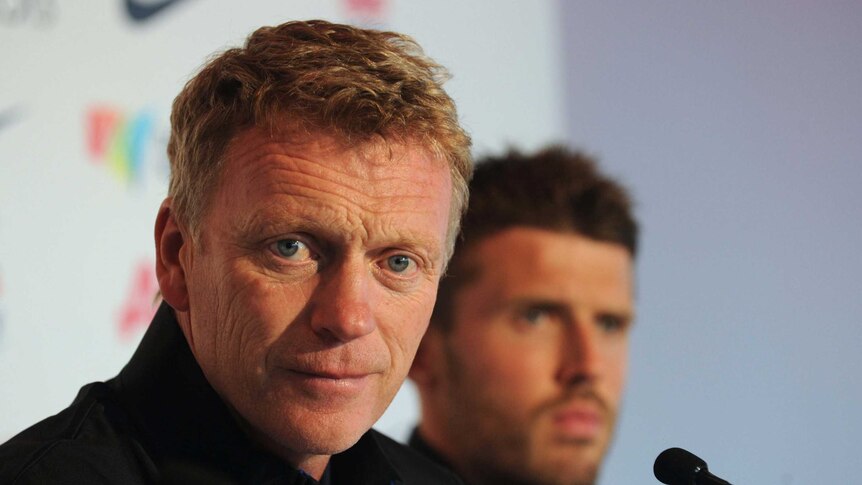 Manchester United manager David Moyes (foreground) and midfielder Michael Carrick