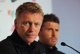 Manchester United manager David Moyes (foreground) and midfielder Michael Carrick