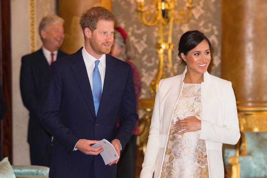 Harry and Meghan attend a reception at Buckingham Palace.