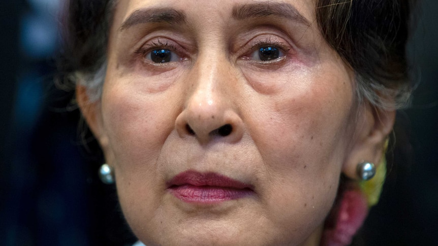 A woman of Asian descent is shown in a close up head shot