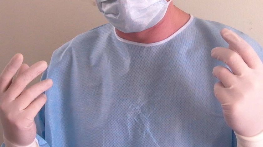 A surgeon readies for surgery