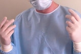 A surgeon readies for surgery