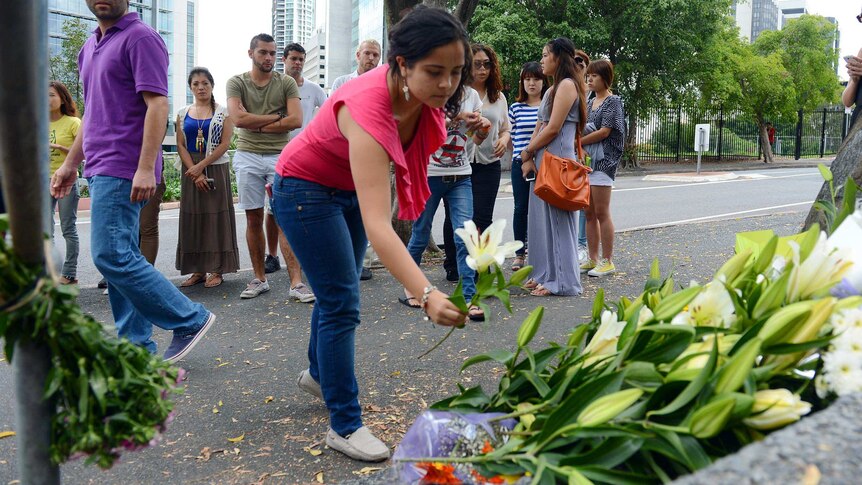 Mourners lay flowers for Eunji Ban