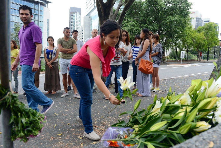 Mourners lay flowers for Eunji Ban