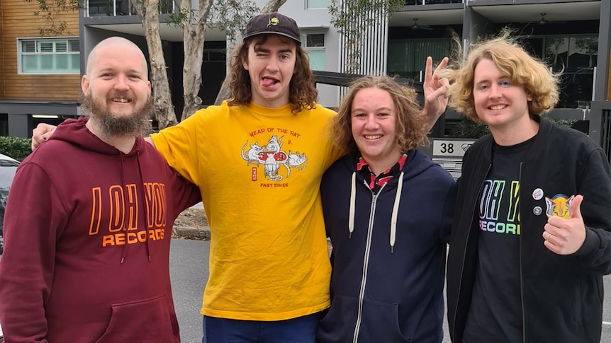 15yo charity raffle organiser Lucas with Mikey from Violent Soho, B.C. from Dune Rats, and Simon from DZ Deathrays