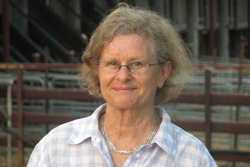 Roberta Doneley in front of the shearing shed and sheep yards.