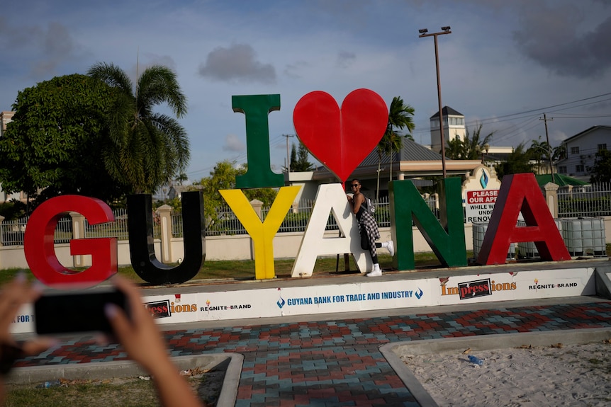 A sign which reads I heart guyana