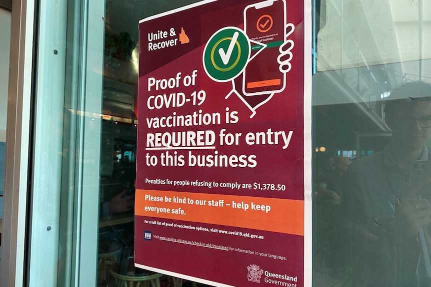 A sign reading "proof of COVID-19 vaccination is required for entry to this business'