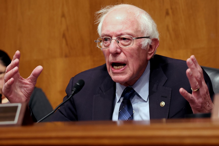 Bernie Sanders gesticulates with his hands.