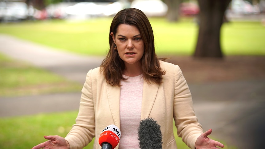 South Australian Greens Senator Sarah Hanson-Young speaking to two microphones