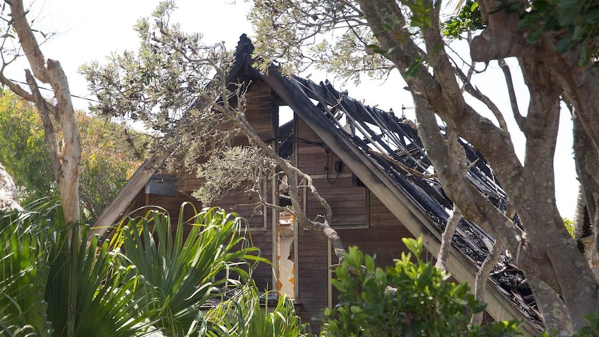 A burnt-out house is seen on Plover Street, Peregian Beach.