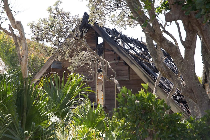 A burnt-out house is seen on Plover Street, Peregian Beach.