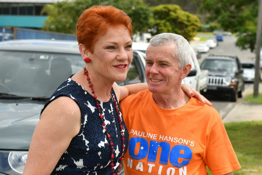 Pauline Hanson puts her arm around Malcolm Roberts