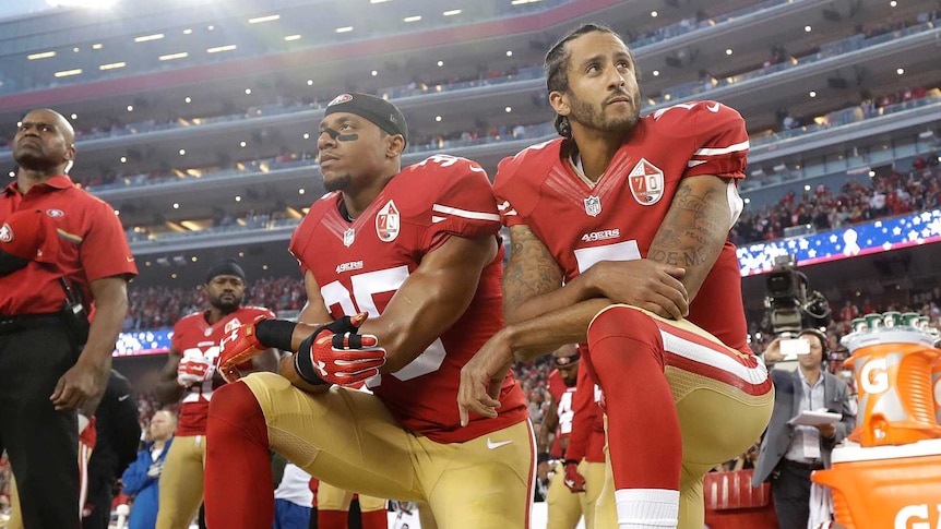 Colin Kaepernick knees for the national anthem