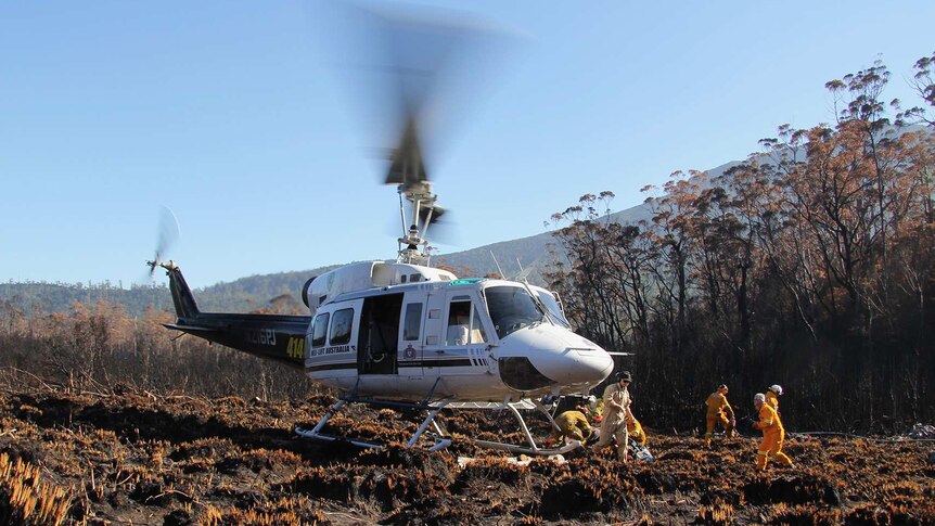 Remote area firefighters at a blaze in Tasmania's south west World Heritage Area, 2016.