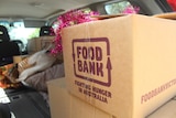 A box bearing the branding of relief charity Foodbank.