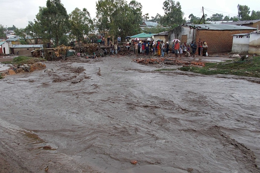 Floodwater rushes through township near Malawi capital Blantyre