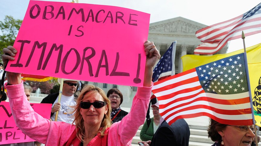Opponents of US president Barack Obama's healthcare legislation rally outside the Supreme Court.