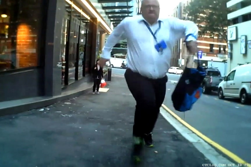 A pedestrian run after a Brisbane cyclist, captured on bike-mounted cameras.