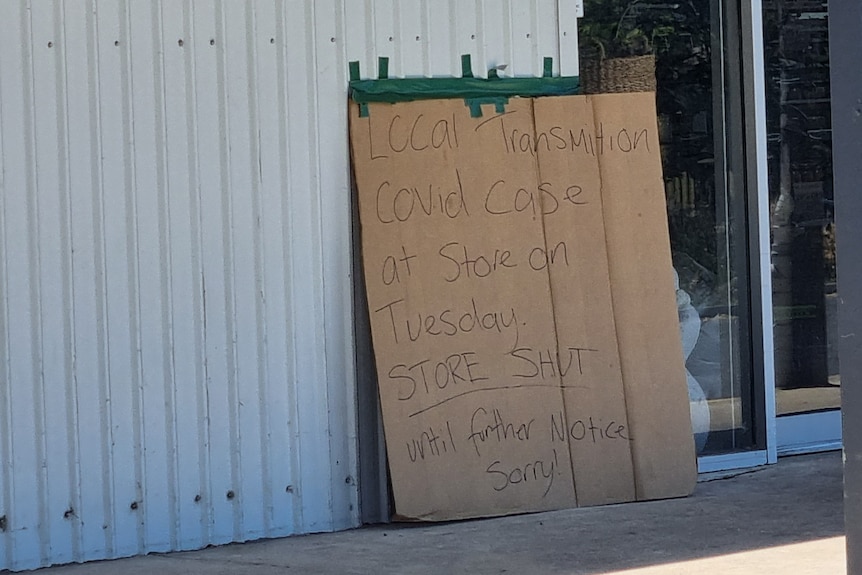 A cardboard sign at Olivers Pets and Plants telling customers it was shut until further notice due to a COVID-19 exposure