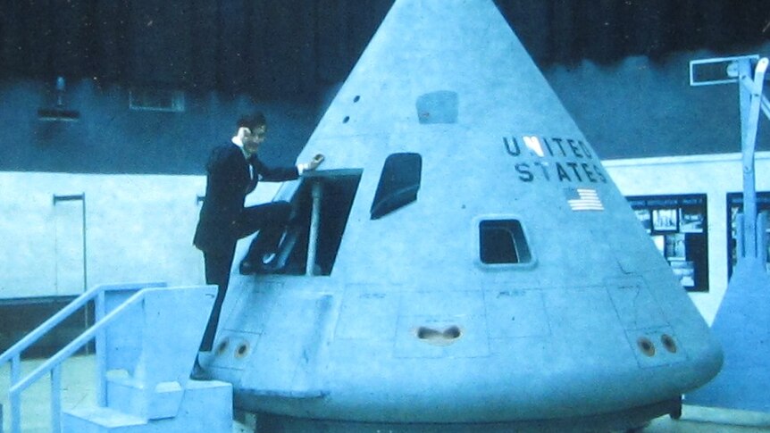 Owen Mace climbs aboard the Apollo Command Module replica in the US.