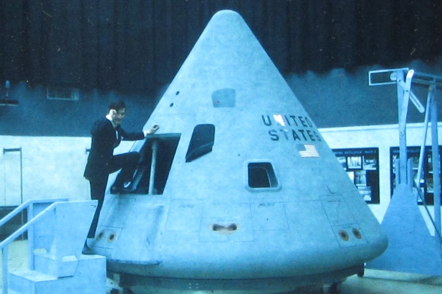 Owen Mace climbs aboard the Apollo Command Module replica in the US.