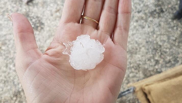 A piece of hail in the palm of a hand at Gleneagle.