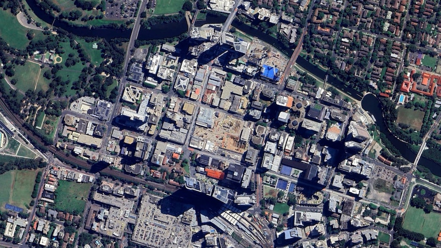In 2024, the completed Parramatta Square skyscrapers cast long shadows, while the Sydney Metro construction site shows that development is far from over.