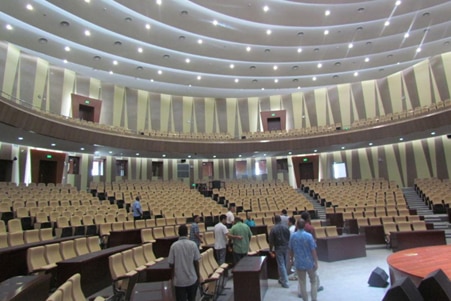 A large, mostly empty auditorium.